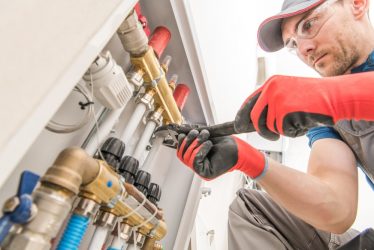 Residential,House,Floor,Heating,Valves,Adjustment.,Plumbing,And,Heating,Technician