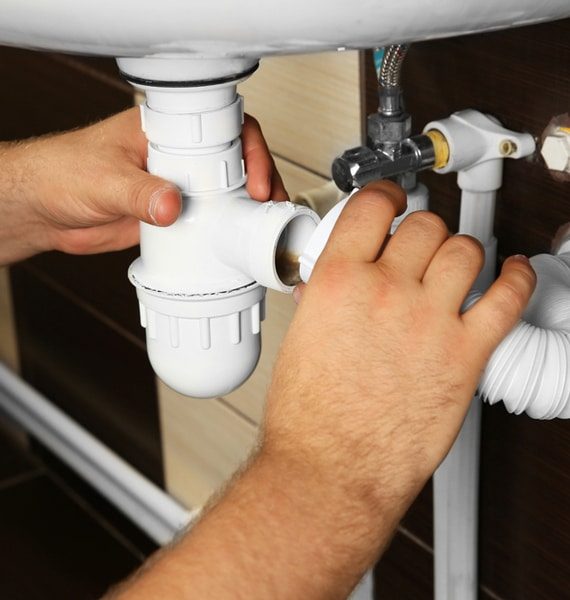 Assembling Sink Pipes — Murphy Plumbing In Hunter Valley, NSW
